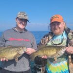 2024 Schultz Sportfishing Picture of a 11# Smallmouth Bass Double!